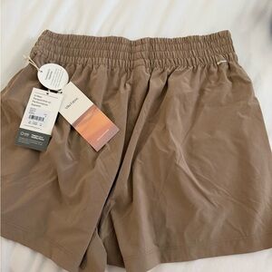 Vuori Women's Athletic Shorts in Tan
